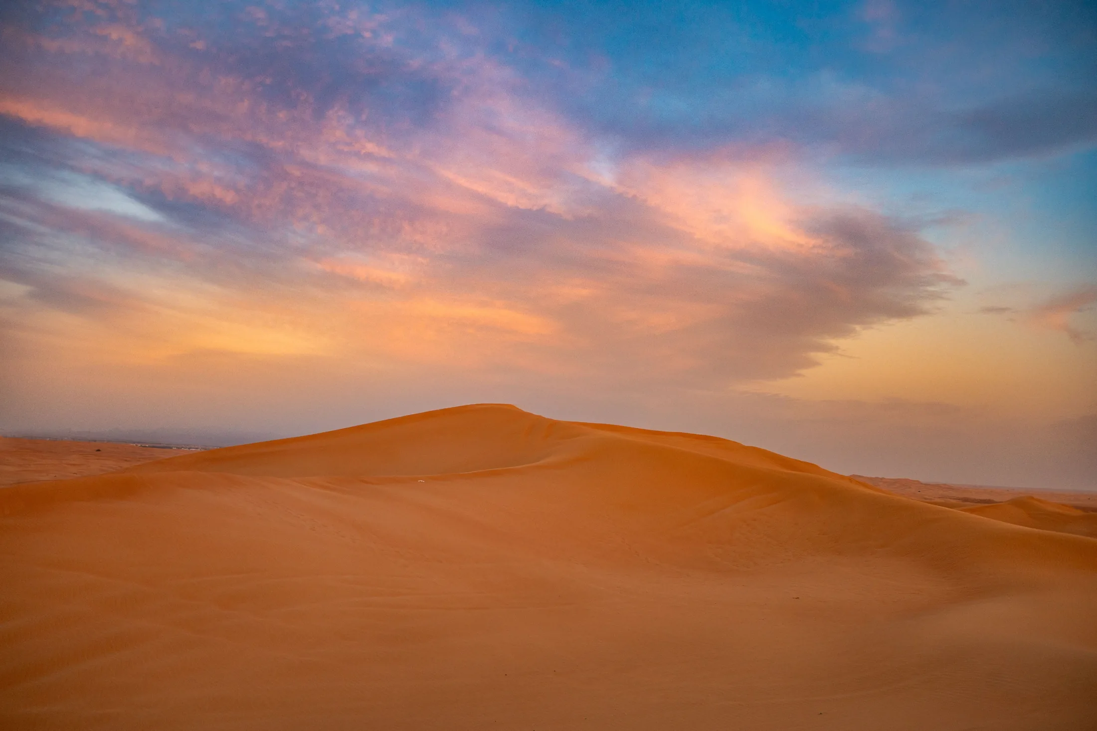 Dubai desert dunes at sunset